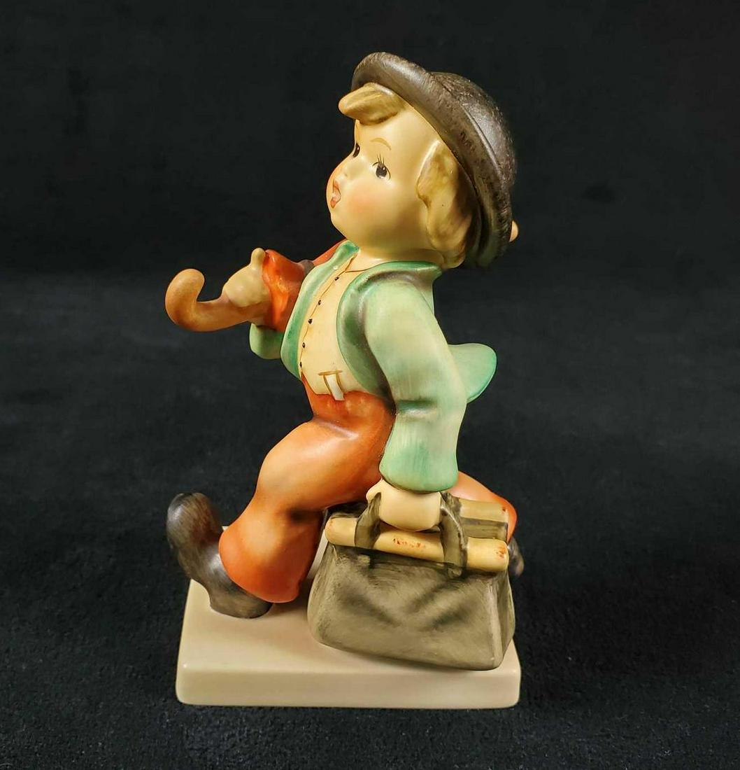 Hummel Goebel Figurine Merry Wanderer HUM 11: A boy heads off for vacation and adventure. The figure is in good, vintage condition with no known damage. Is approx 2" x 3" x 5". Made in East Germany. Hand-painted porous earthenware. Please note, t