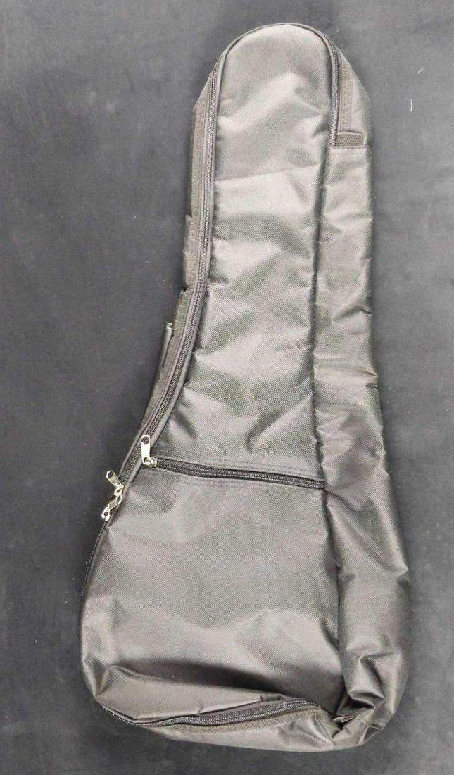 Kala Brand Music Company Tenor Ukulele Soft Bag: Lightweight padded gig bag with plush interior. Accessory Pocket and adjustable Straps/ 12mm padding and Black Cordura Material. Gigbag is approx 27" x 12". Is in good, unused condition with no known 