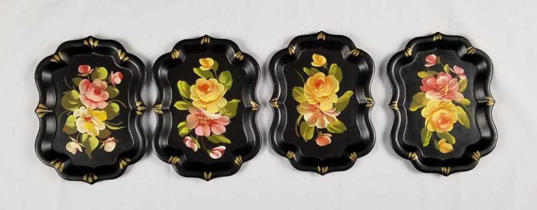 Toleware Floral Scalloped Metal Plates A: Toleware Floral Scalloped Metal Plates A lot of 4 is a beautiful set. They hand painted flowers rest on a matte black and have a gold accent on the scalloped edges. They are in good vintage condition