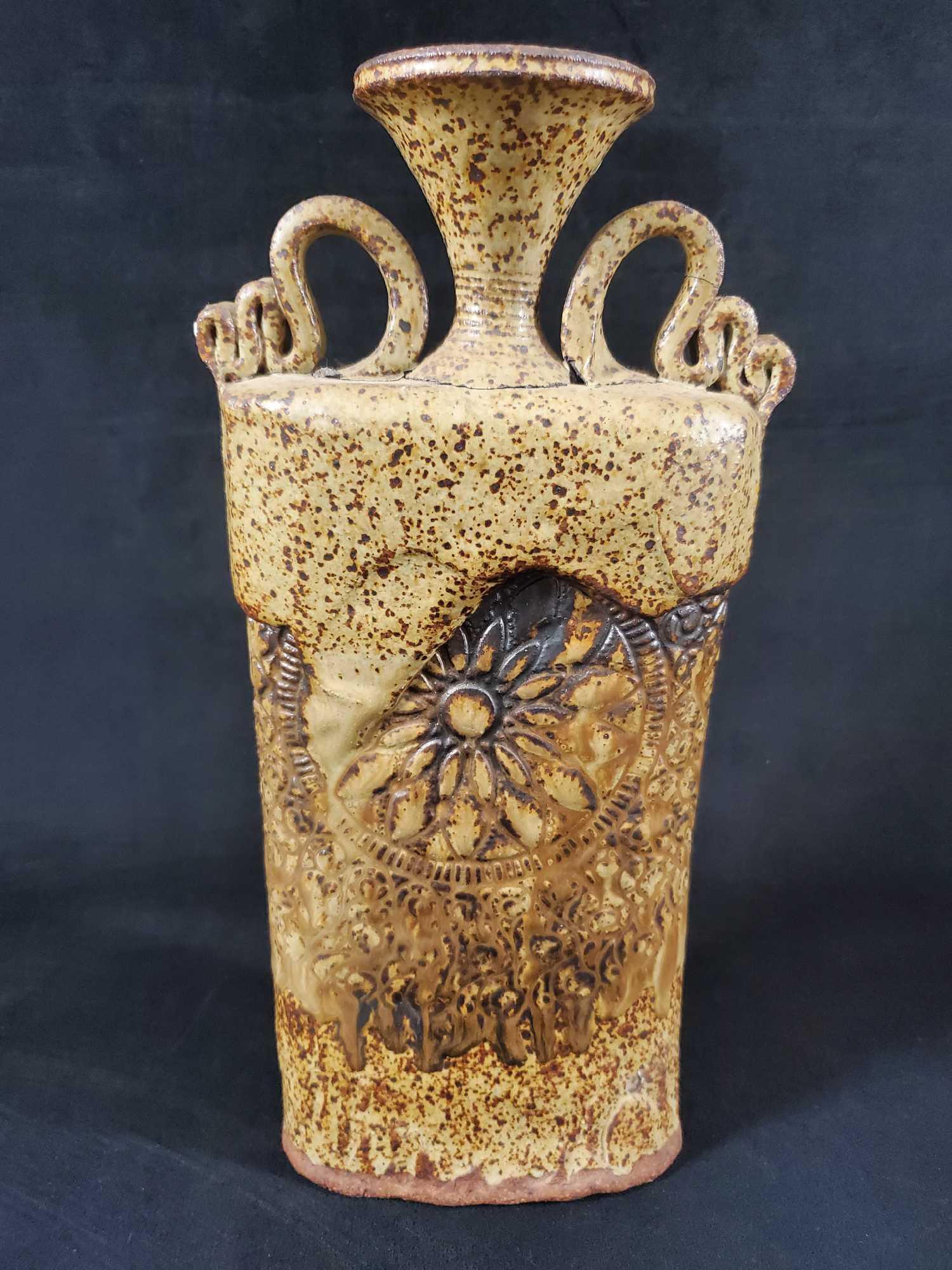 Unique Vintage Earthenware Abstract Urn Vase: Beautifully textured abstract heavy vase/urn with a sunflower motif. Signed on the side by what appears to be an 'Spillo' '97. Vase is in good, vintage condition with no known damage. Vase is approx 6