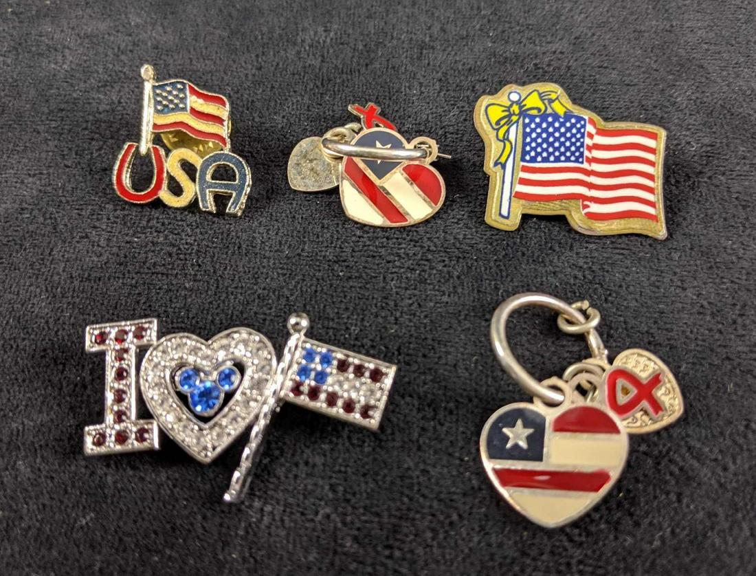 USA Pins And Charms Disney: This lot includes: 1.Flag With Yellow Ribbon pin 2.Flag with USA in Red, White & Blue pin 3.Two USA Heart charms 4. I Mickey Heart USA Flag with crystals. Pins and charms are in good, used condition w