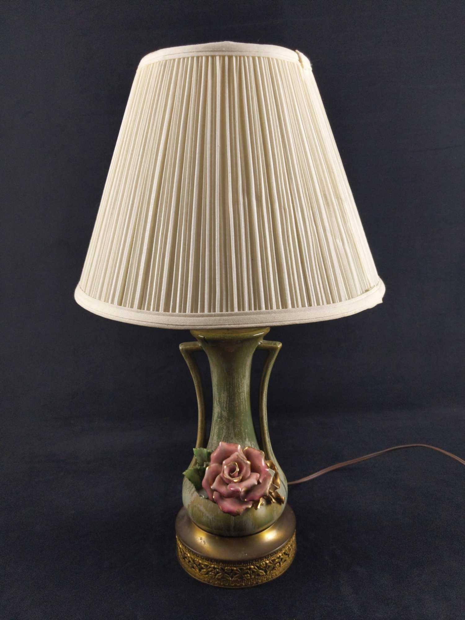 Vintage Ceramic Pink Rose Table Lamp With Shade: Here is a lamp that adds class to any bedroom or reading room. The ceramic body sits upon a brass base and body has a rather detailed rose on the front of the body. Rose and body are all hand-painted.