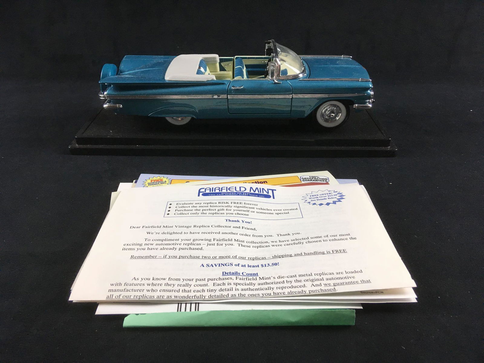 Fairfield Mint Chevrolet 1959 Impala: Fairfield Mint Chevrolet 1959 Impala. This model car is in great condition. It is included in the original box with paperwork. The car is light blue die-cast metal with a black plastic base. Has a con