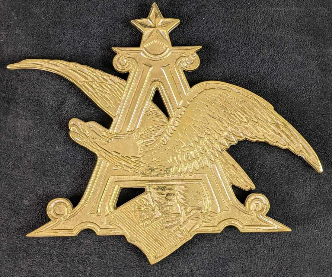 Vintage YM Solid Brass Anheuser Busch Trivet B: Vintage YM Solid Brass Anheuser Busch Trivet. Is approx 10" x 9" and is in a good, vintage condition with light surface tarnish.