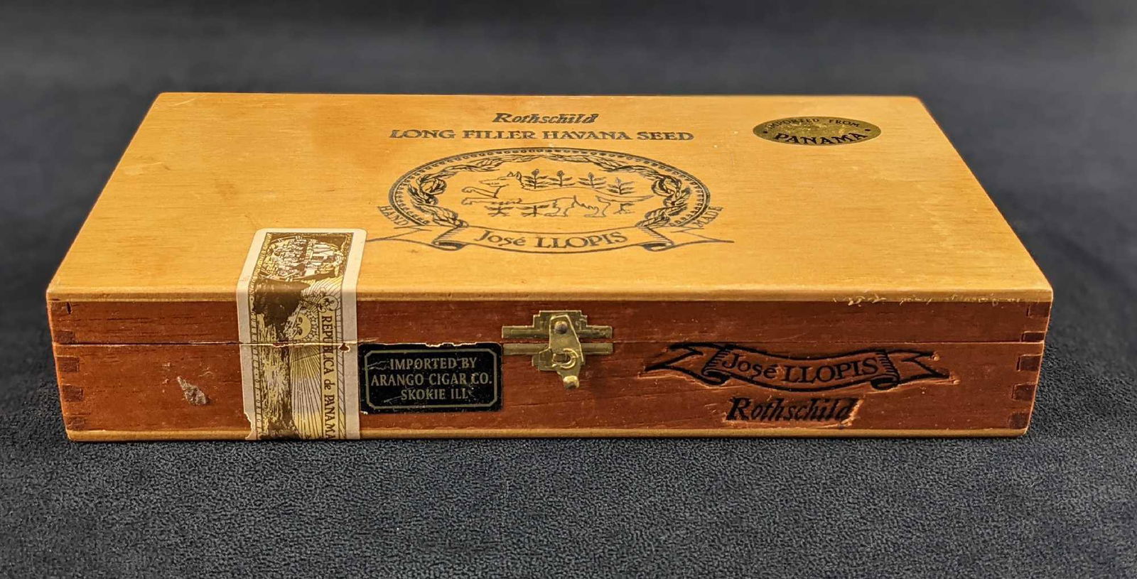 Panama Rothschild Jose Llopis Wooden Cigar Box: Vintage wooden Rothschild Box From Panama. Is approx 11" x 5 1/2" x 2" and is in a good, used condition with some wear on the box. Hatch works properly. This sturdy little box would make ideal jewelry
