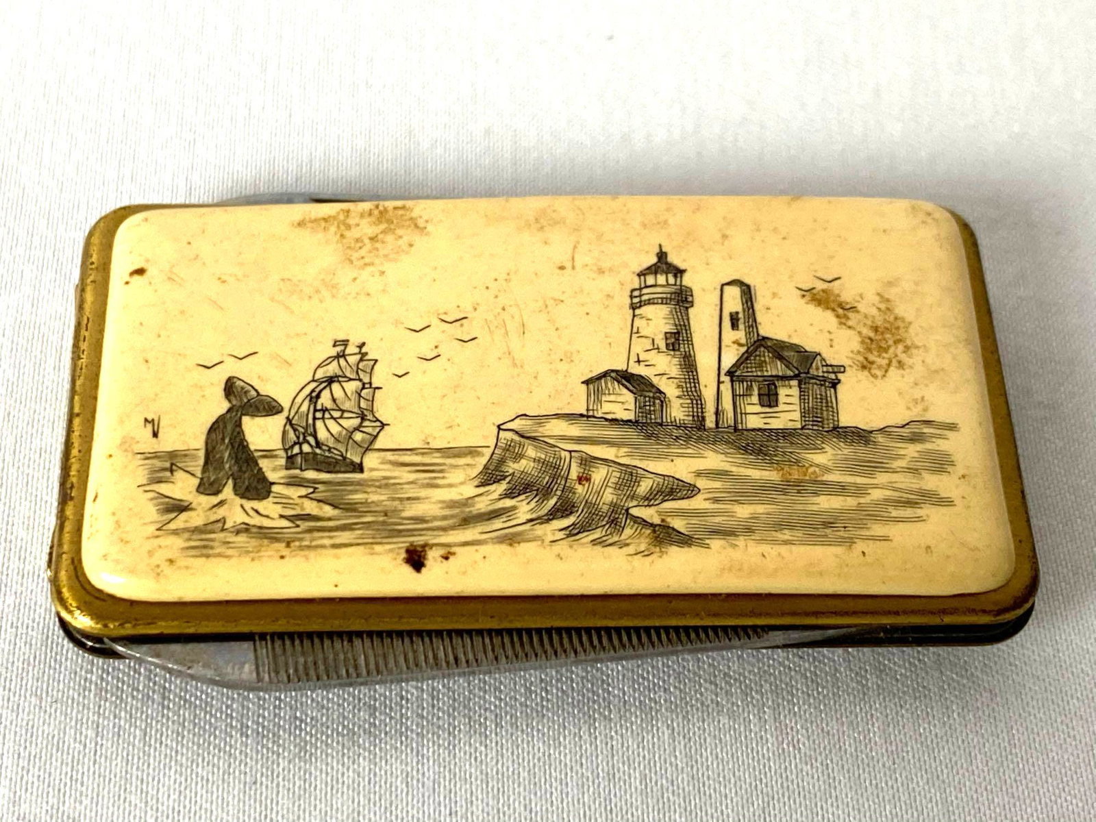 VINTAGE SCRIMSHAW MONEY CLIP W/ANVIL FOLDING KNIFE &: VINTAGE SCRIMSHAW MONEY CLIP W/ANVIL FOLDING KNIFE & NAIL FILE. Vintage Money Clip With Anvil Folding Knife And Nail File 2" Long Gold With Silver Money Clip And Knife And Nail File Great Collectors I