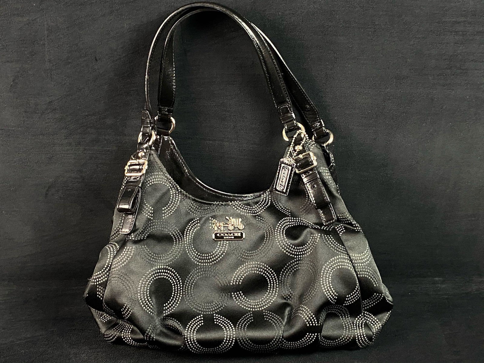 Authentic Coach Dotted Madison Op Art Maggie Bag #16505: DESCRIPTION Authentic Coach Shoulder Handbag Madison Collection, Maggie Dotted Op Art Purse K1020-16505. Inside zip, 1 cell phone and another multifunction pocket, and 3 compartments: 2 outer with mag
