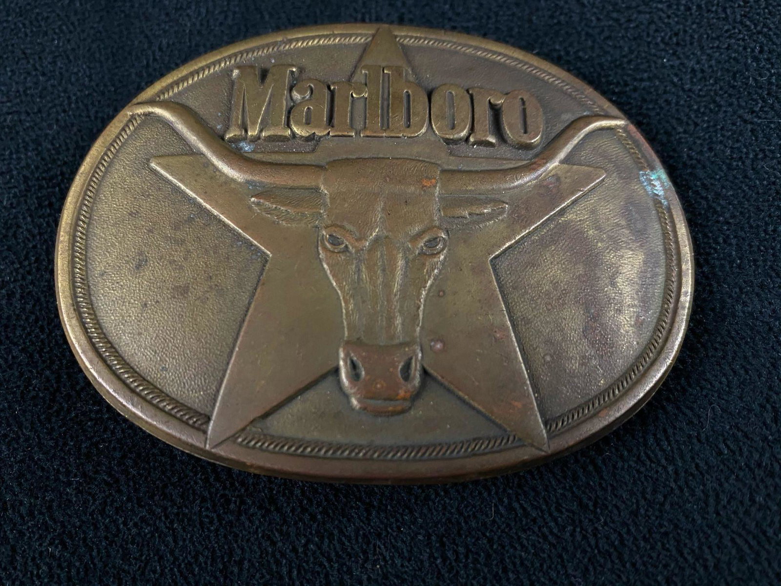 Vintage Marlboro Bull and Star Solid Brass Belt Buckle: Vintage Marlboro Bull and Star Solid Brass Belt Buckle 1987 Phillip Morris in great vintage condition 3.25" x 2.5"