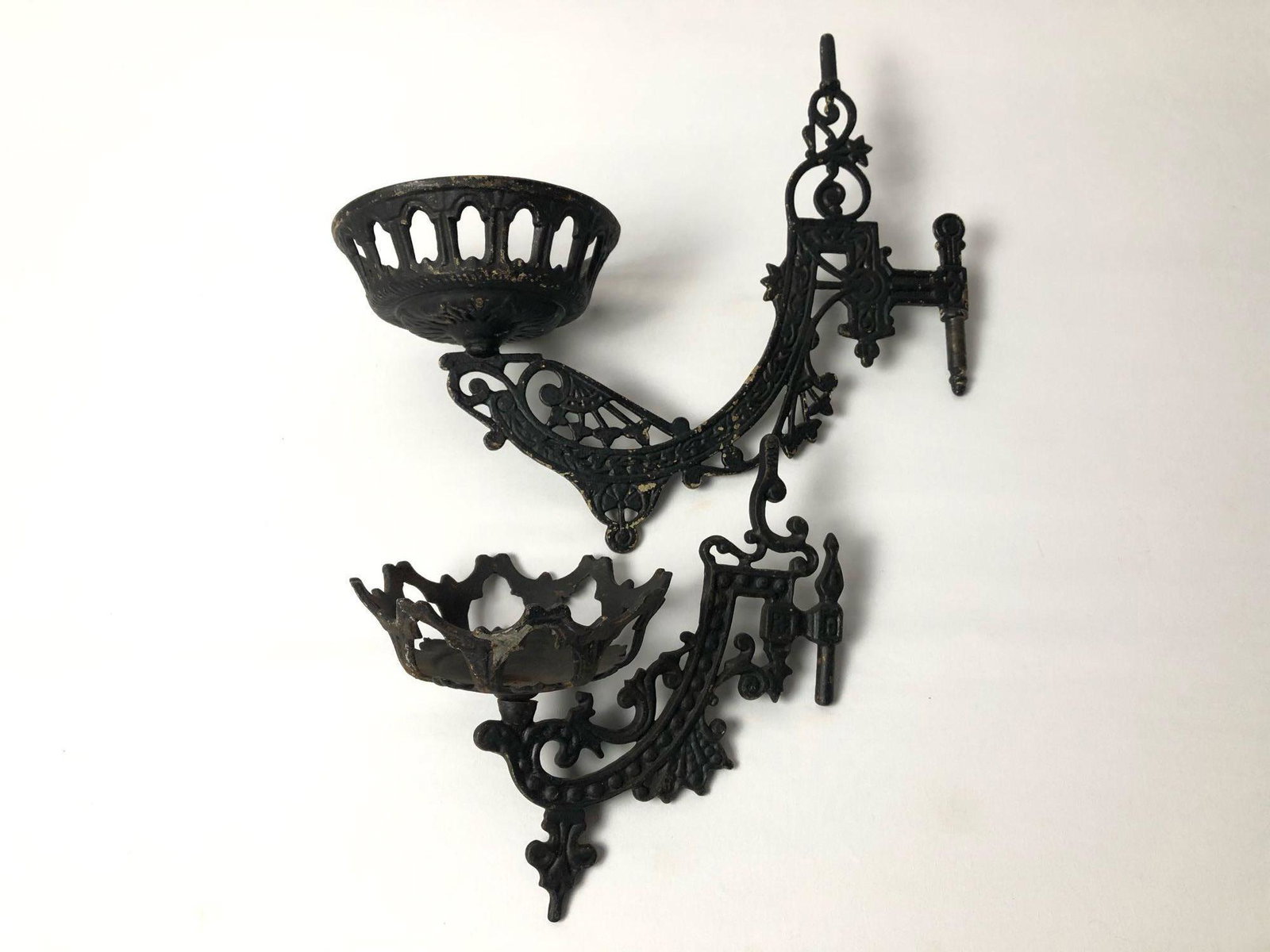 Antique Cast Iron Wall Sconces Candle Holder Arms: Antique Cast Iron Wall Sconces Candle Holder Arms . These sconces are in good condition excellent for repair or restoration project . Details : Smaller one 8" x 8" 7mm Pin Larger 12" x 10" 9mm Pin 3.5