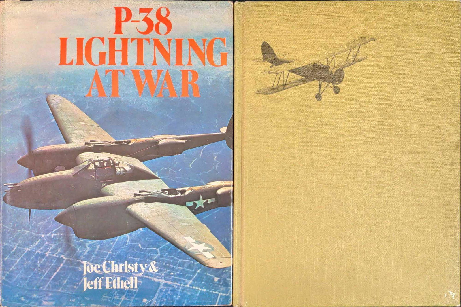 Two Vintage World War FIghting Planes Hardcovers: This lot includes: (1) P-38 Lightning At War By Joe Christy & Jeff Ethell. Published by Charles Scribner's Sons in 1961. The book is approx 8 1/2" x 1/2" x 11" and the book is in a good, vintage condi