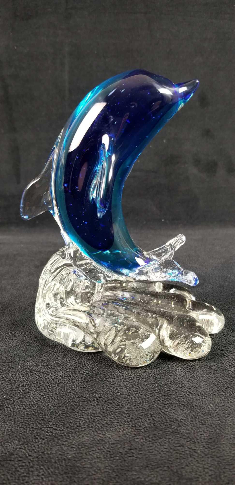 Murano Glass Cobalt Blue Dophin on Wave B: Cobalt blue Murano Glass Dolphin on Wave statue is a lovely piece. Murano sticker on the bottom of the statue. In good vintage condition with no known damages. Approx. measures 3 3/4" x 4 1/2" x 6 1/4
