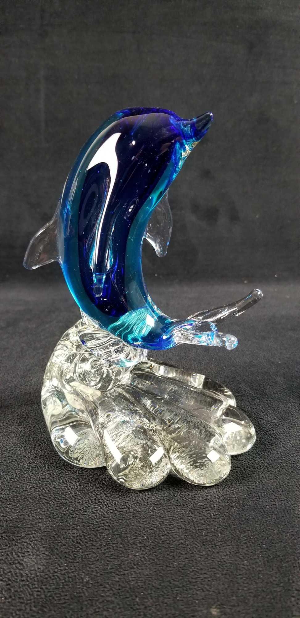 Murano Glass Cobalt Blue Dophin on Wave A: Cobalt blue Murano Glass Dolphin on Wave statue is a lovely piece. Murano sticker on the bottom of the statue. In good vintage condition with no known damages. Approx. measures 3 3/4" x 4 1/2" x 6 1/4