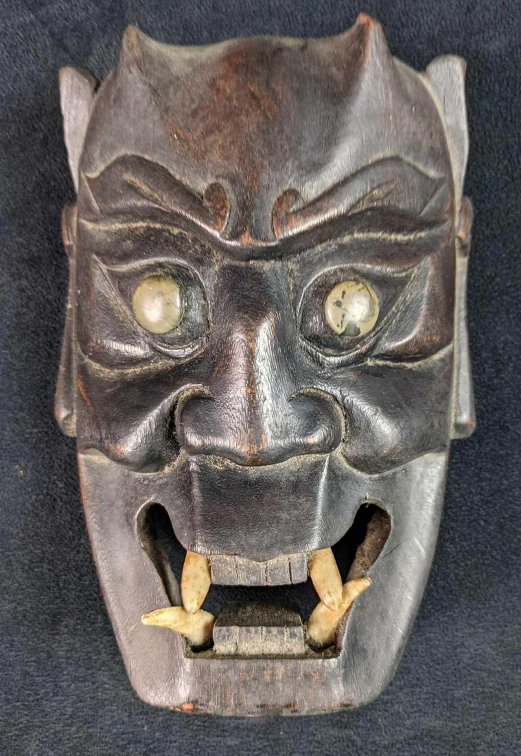 Vintage Handcarved Wooden Japanese Style Demon Mask: Vintage Handcarved Wooden Japanese Style Demon Mask. The maker and date of creation is unknown. Is ready to hang on the wall. Mask is approx 5" x 3" x 7". Mask is in a good, vintage condition with som