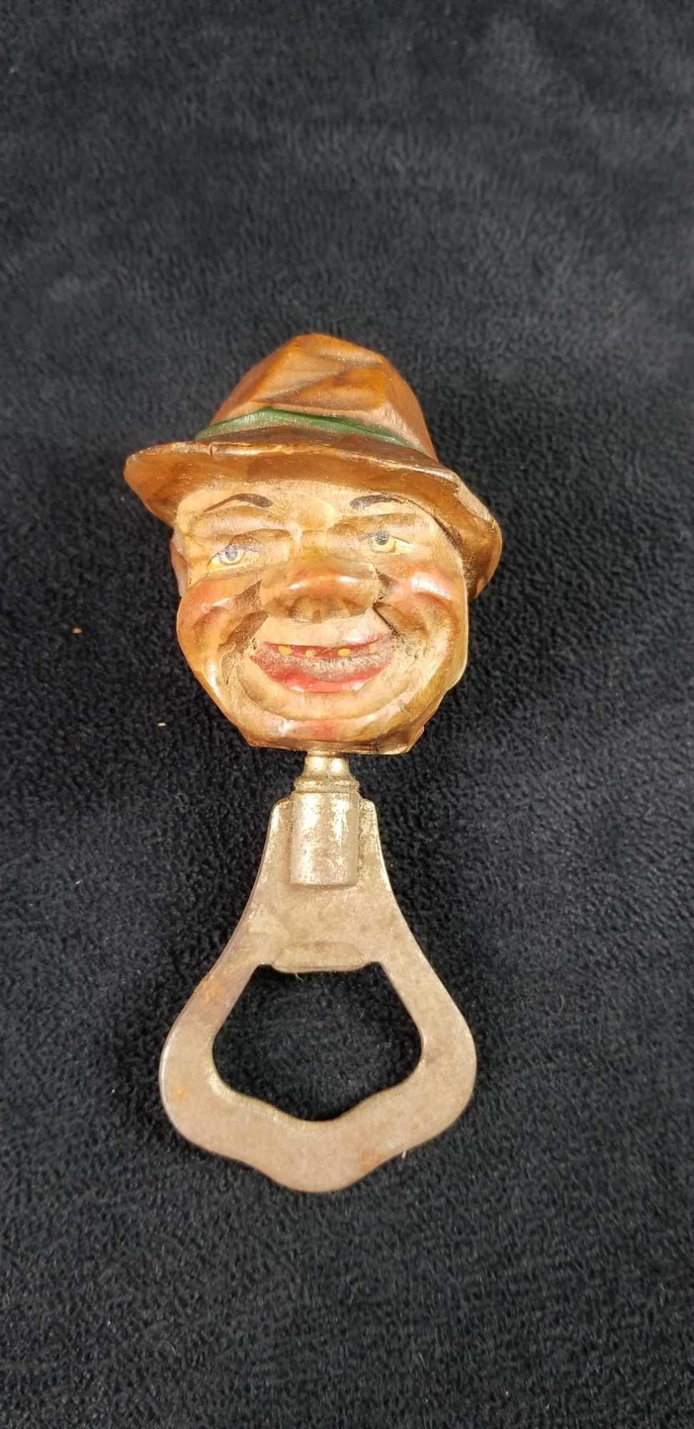 Bar Bottle Opener Wooden Hand Carved Head: Wooden hand carved head of male character on bottle opener. Carved wood is painted. Maker and date unknown. In good used condition. Approx. measures 2" x 2" x 4"