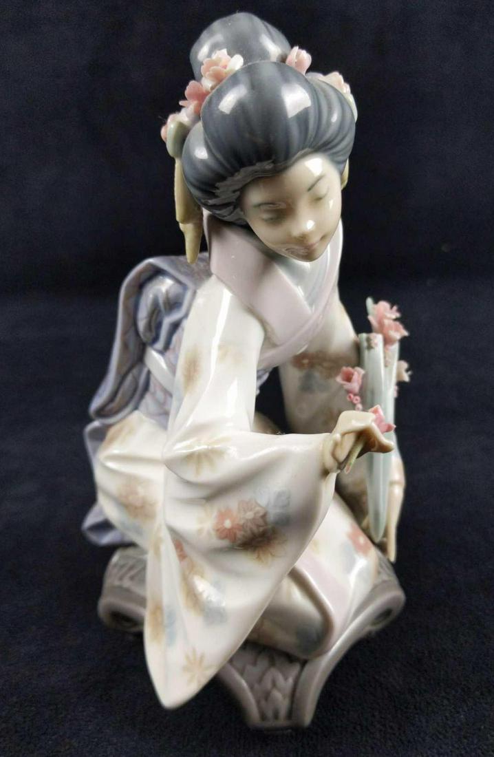 Sold Out Lladro Kiyoko Girl Picking Flowers Figurine: Kiyoko Glossy 1450. This figure was created and released by Salvador Debon in 1983 and retired in 1998. Is 4" x 4" x 7". The figure is in good, used condition with no known damage.