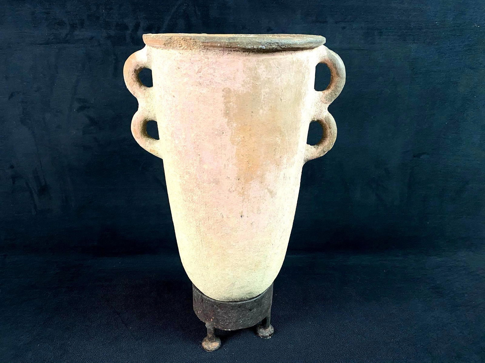 Antique 4 Eared Clay Vessel With Cast Iron Stand: Antique 4 Eared Clay Vessel With Cast Iron Stand. This piece with heavy patina is in great condition for its age with no chips cracks or repairs ready to be displayed . No maker marks or hallmarks fou