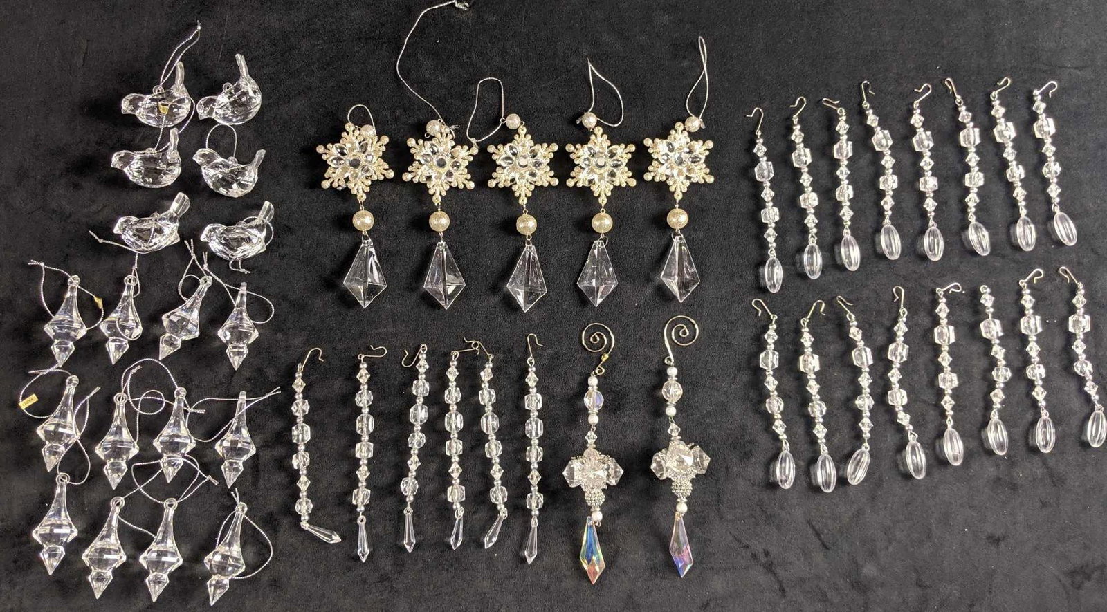 Christmas Clear Acrylic Ornament Lot: This lot includes: 1. Six acrylic robin ornaments. These are approx 2" x 2" 2. Five acrylic snowflake ornaments. These are approx 2'' x "9. 3. Twelve acrylic ice circles. These are approx 1" x 5". 4. 