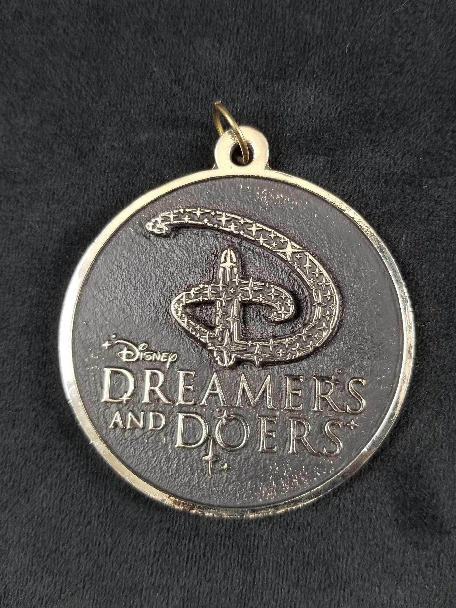 Disney Dreamers Doers Medallion Medal Curiosity: Disney Dreamers Doers Medallion Medal Curiosity Confidence Courage Constancy Memorabilia This is a Dreamers and Doers medallion with encouraging words in the back - CURIOSITY-CONFIDENCE-COURAGE-CONSTA