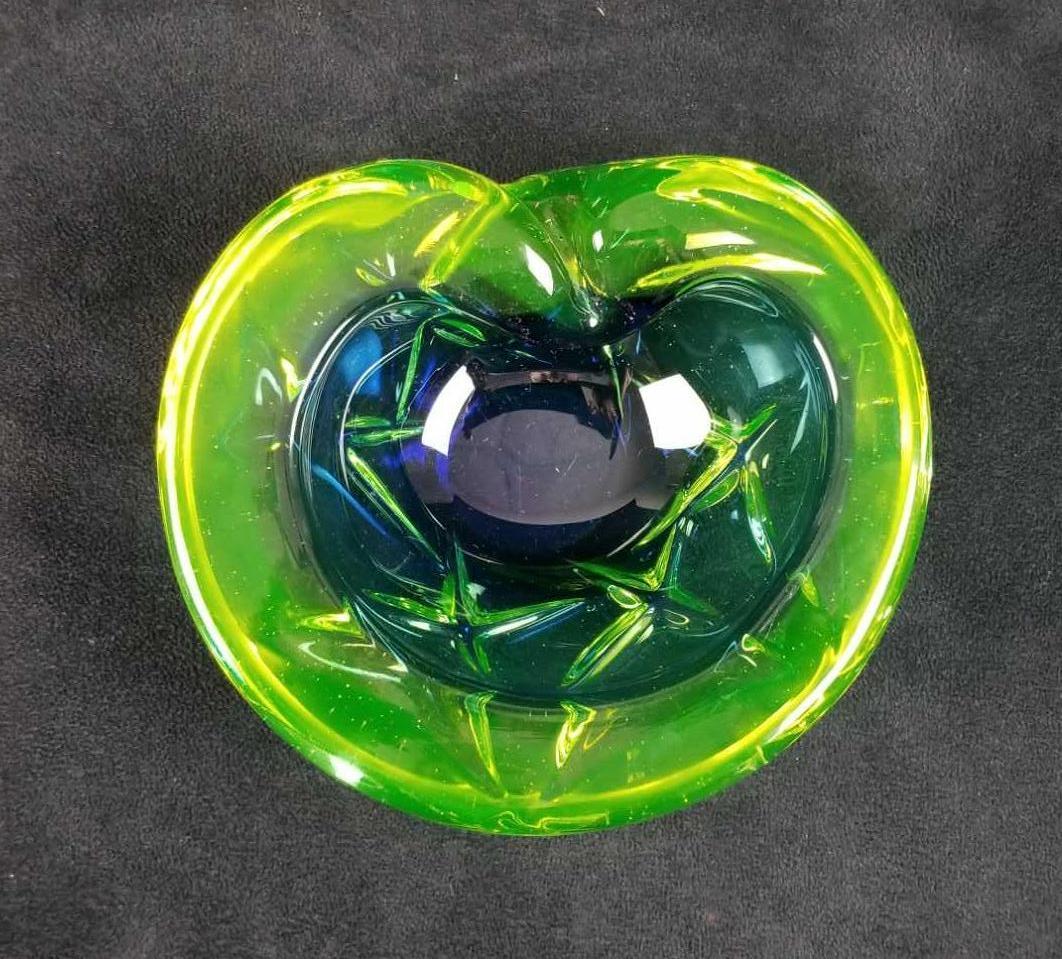 Murano Blue Green Ashtray: Murano Blue Green Ashtray has a sleek design. For those collectors out there this is a nice pice. In good vintage condition. Approx. measures 6" x 6 1/2" x 2, weight is 2.5lbs