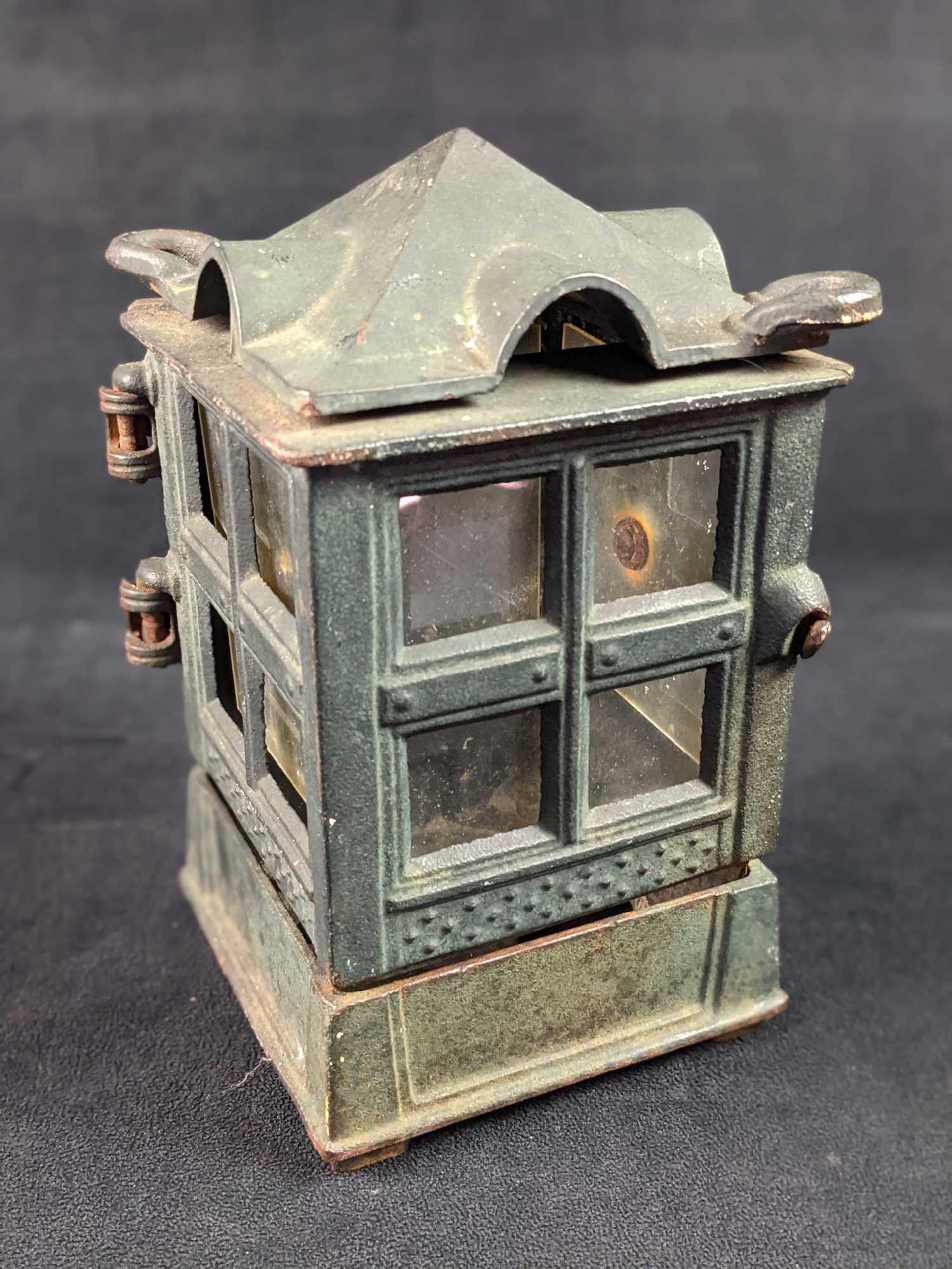 John Wright 1988 Cast Iron Lantern: A wonderful addition to garden or patio - indoors or out this fun cast iron garden lantern by John Wright. has a wonderful stylish Asian modern form. Is approx 5" x 5" x 9" and is in a fair, used cond