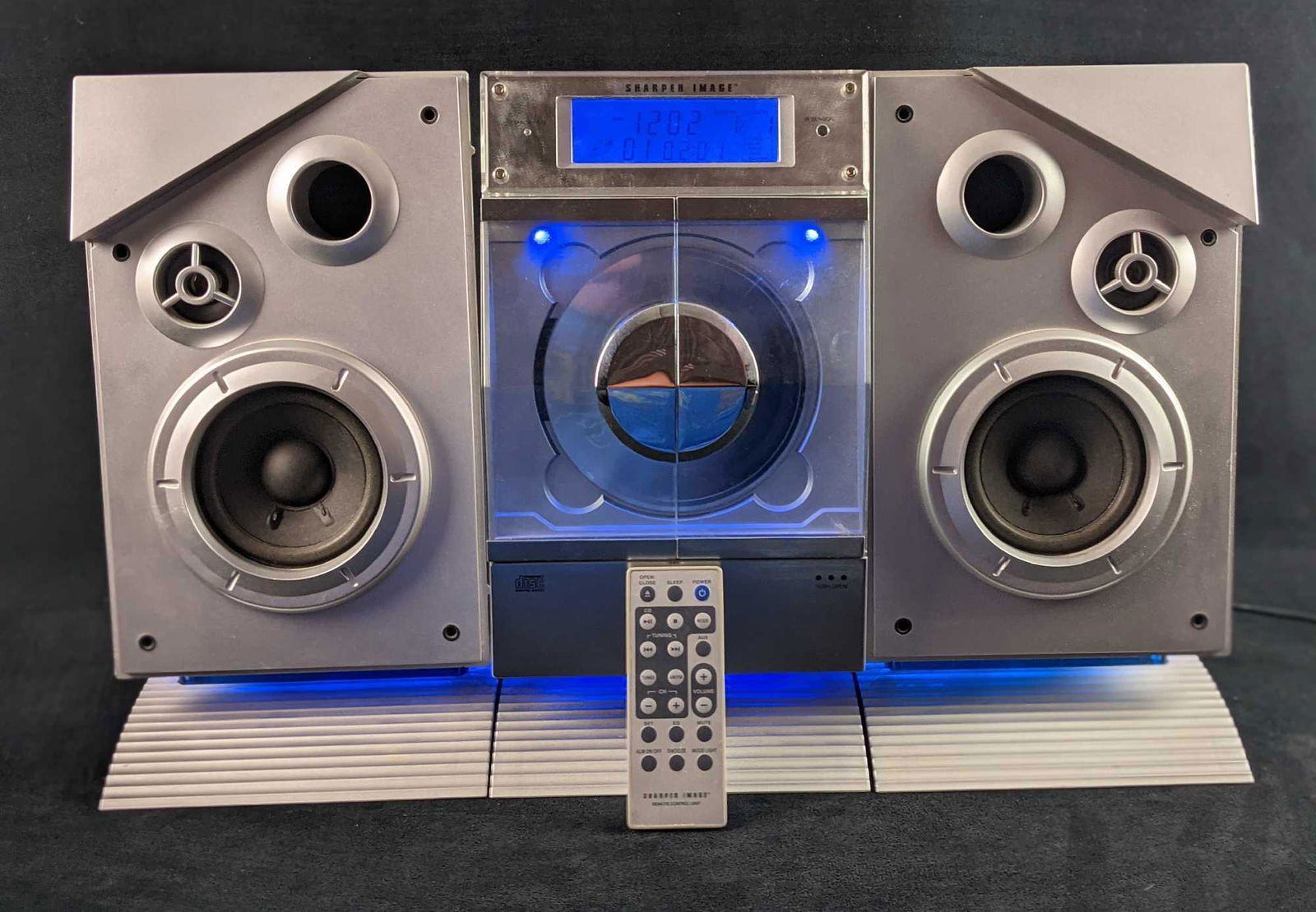 Sharper Image Sleek CD Stereo Radio Alarm Box: "Sleek CD" by Sharper Image. Fun little CD/Radio/Alarm all in one! Comes with everything you see in the images. Everything was tested and it all works. Sounds great! Please note, the middle control pa