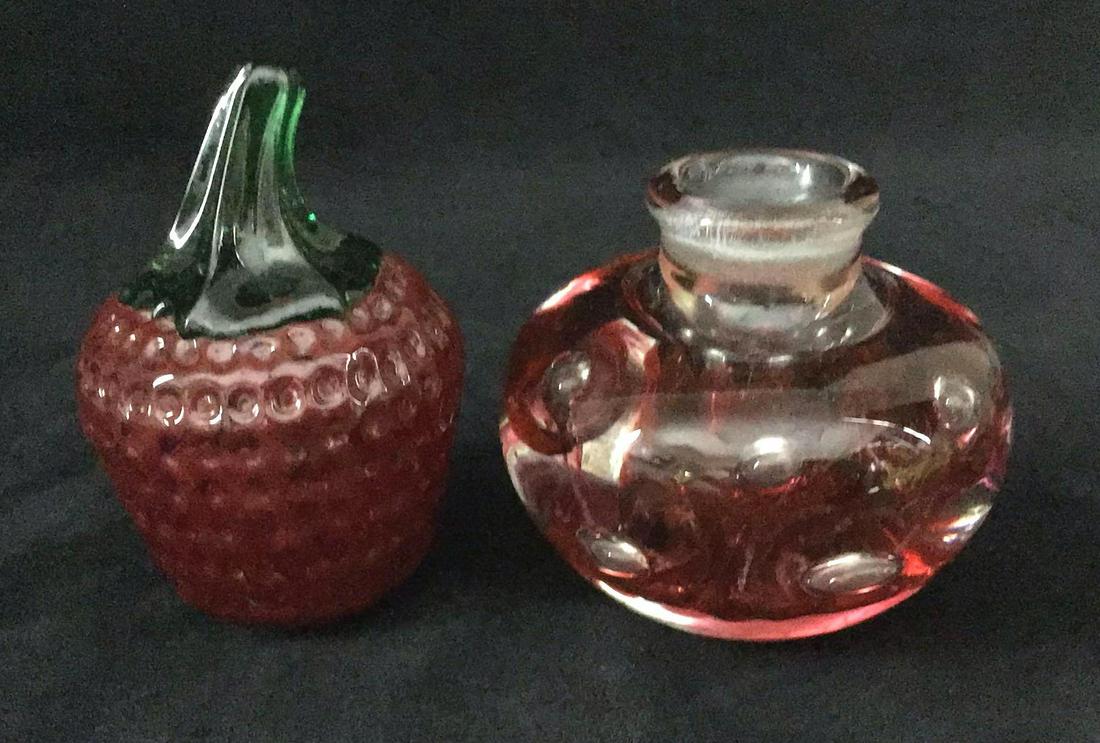 Glass Art designer Joe Rice Strawberry Candlestick Lot: Glass Art designer Joe Rice Strawberry Candlestick. This is a lot of two glass art pieces. They state to be made by Joe St.Clair who is a known craftsman of glass art. They are in good condition with 