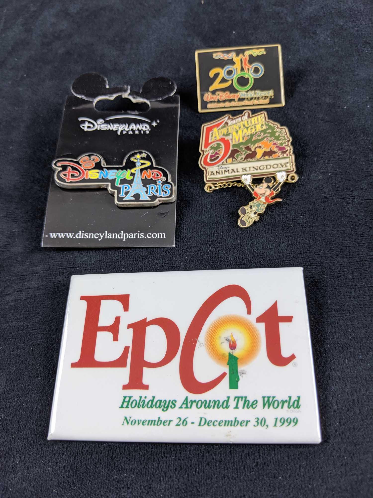 Disney Theme Park Exclusive Pins: This lot includes: Rare "Disneyland Paris" pin with original backing, Cast member exclusive "Animal Kingdom 5 Years Of Adventure" pin. "Epcot Holidays Around The World". Red Edition. And "Walt Disney