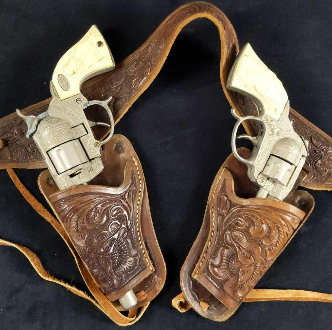 Vintage Gene Autry Bill Hickok Cap Gun W Holster: This root'n, toon'n cap gun shoot'n lot includes: (1) Vintage Leslie Henry 44 Gene Autry Cap Gun Pistol from the 1950s. This is the large die-cast with engraving, revolving cylinder, and the L-H ovals