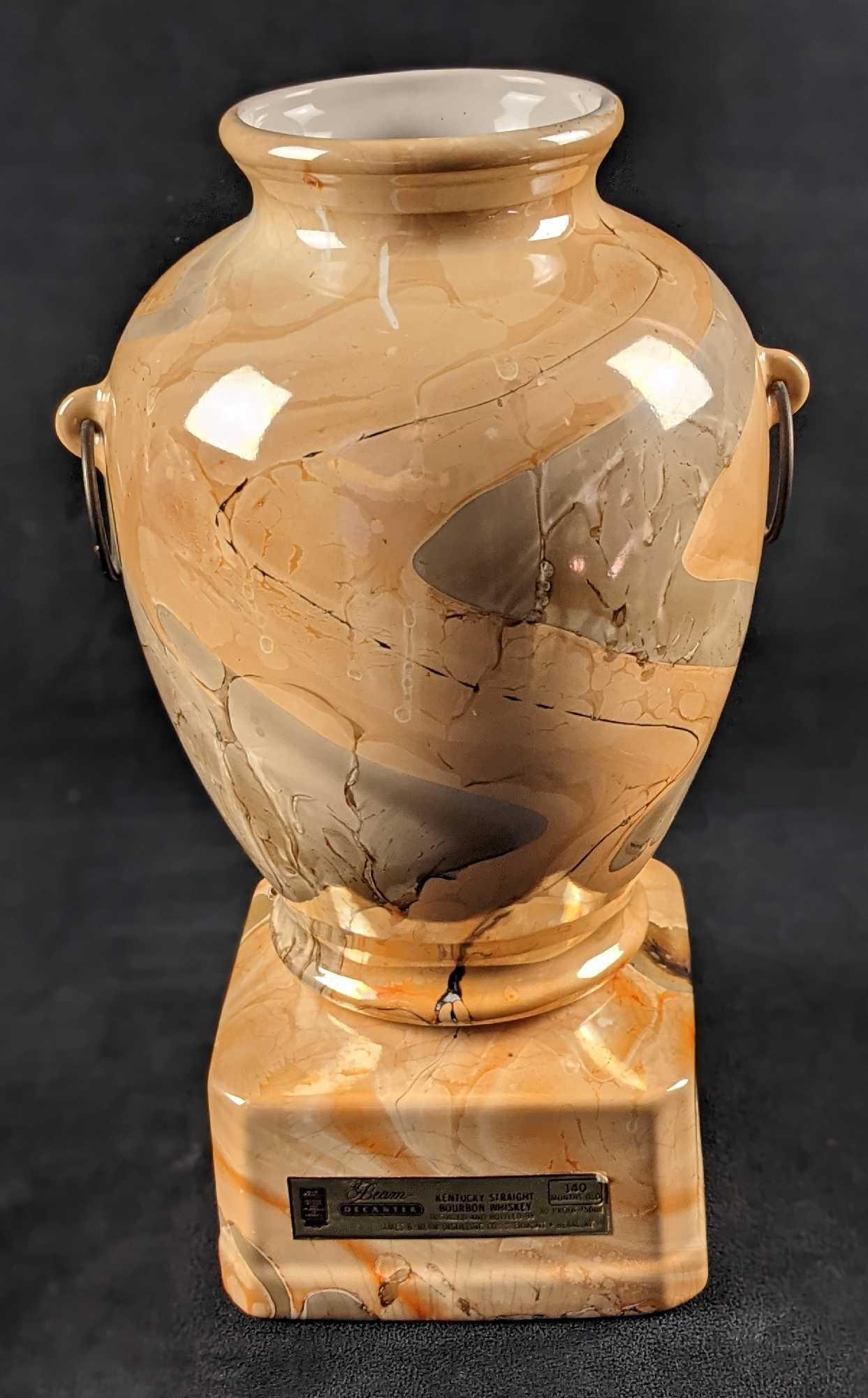 Vintage Jim Beam Whiskey Decanter Bottle Marble Vase A: Vintage Jim Beam decanter. It looks like a marble vase with two handles on the side.Bottom is dated 1985 & made out of Genuine Regal China. Vase is attached to decanter base via Velcro. Please note, t