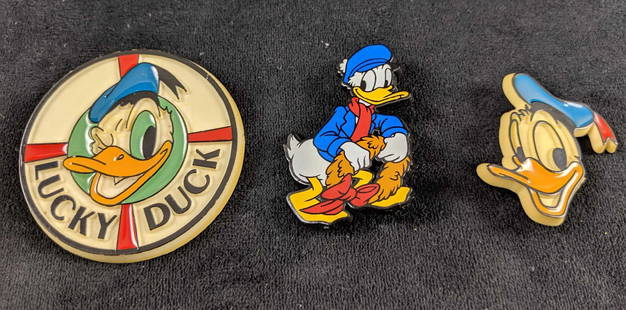 Disney Lot Of Three VIntage Pin Buttons: This lot consists of: Lucky Duck Pin, Happy Donald, and Christmas Donald. All plastic buttons. All are in good, vintage condition with no visible markings or scratches. All approx 2 1/2 " 2 1/2"