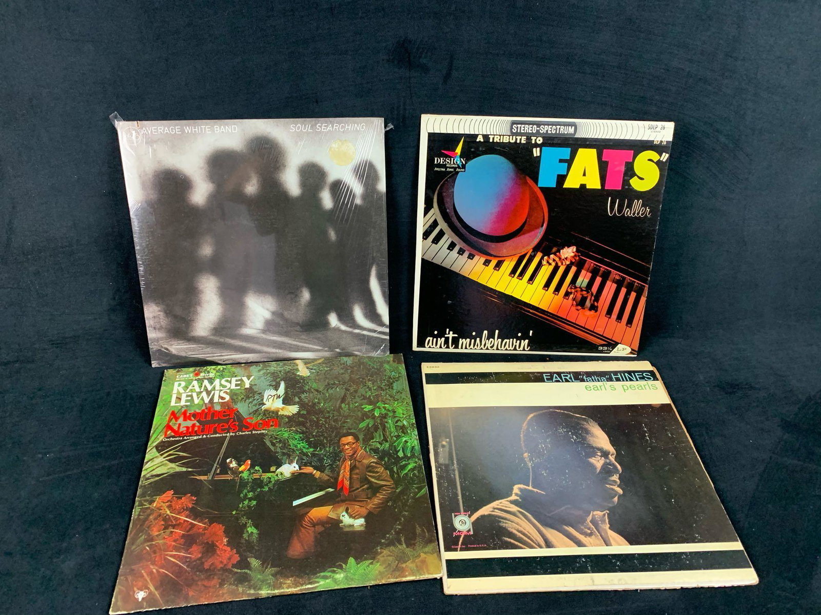 Lot of 4 Vinyl Albums: Lot of 4 Vinyl Albums 1) Average White Band: Soul Searching. Copyright, 1976 2) A Tribute To Fats Waller: Ain't Misbehavin'. Copyright, unknown 3) Ramsey Lewis: Mother Nature's Son. Copyright, 1968 4)