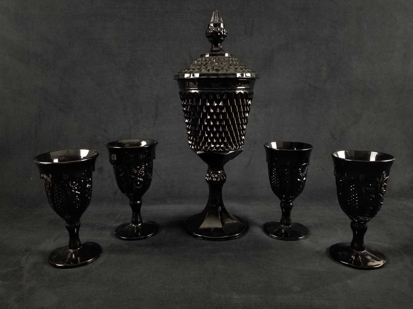 Vintage Tiara Indiana Glass Ebony Black Diamond Wine: Tiara Glass was marketed by Tiara Exclusives of Dunkirk, Indiana, USA through home-parties held by sales agents, between 1970 and 1998. Wine glasses are approx 3
