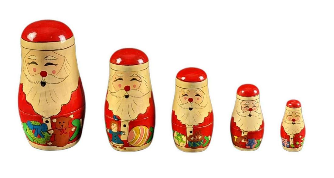 Handpainted Wooden Christmas Santa Claus Nesting Doll: Here is a festive little wooden Santa Claus nesting doll. The doll opens up to four other small Santa-Men. Nesting doll is approx 2 1/2" x 2 1/2" x 5" and weighs under one pound at 0.32lb. The nesting