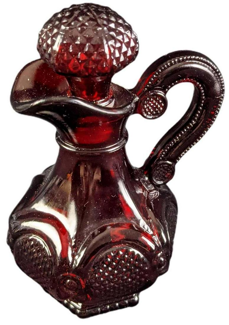 Vintage Avon Cape Cod Ruby Glass Cruet: This design was released from 1975 - 1992 by Avon. The cruet is approx 4" x 3" x 6" and weighs under one pound at 0.69lb. The cruet is in a good, vintage condition with no known damage.