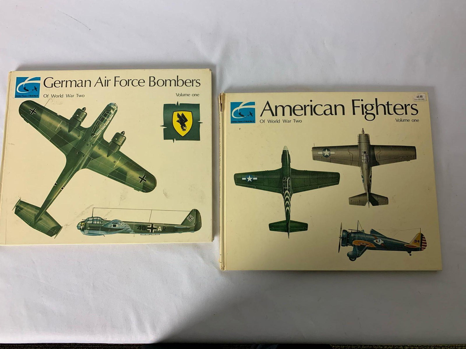 2 Hardcover Volumes " American fighters of WW2 Vol. 1": 2 Hardcover Volumes " American fighters of WW2 Vol. 1" and "German Air Force Bombers of WW2 Vol. 1" Series Editor: C.W. Cain copyright 1968 Condition:(both books) Good. Some slight staining on covers 