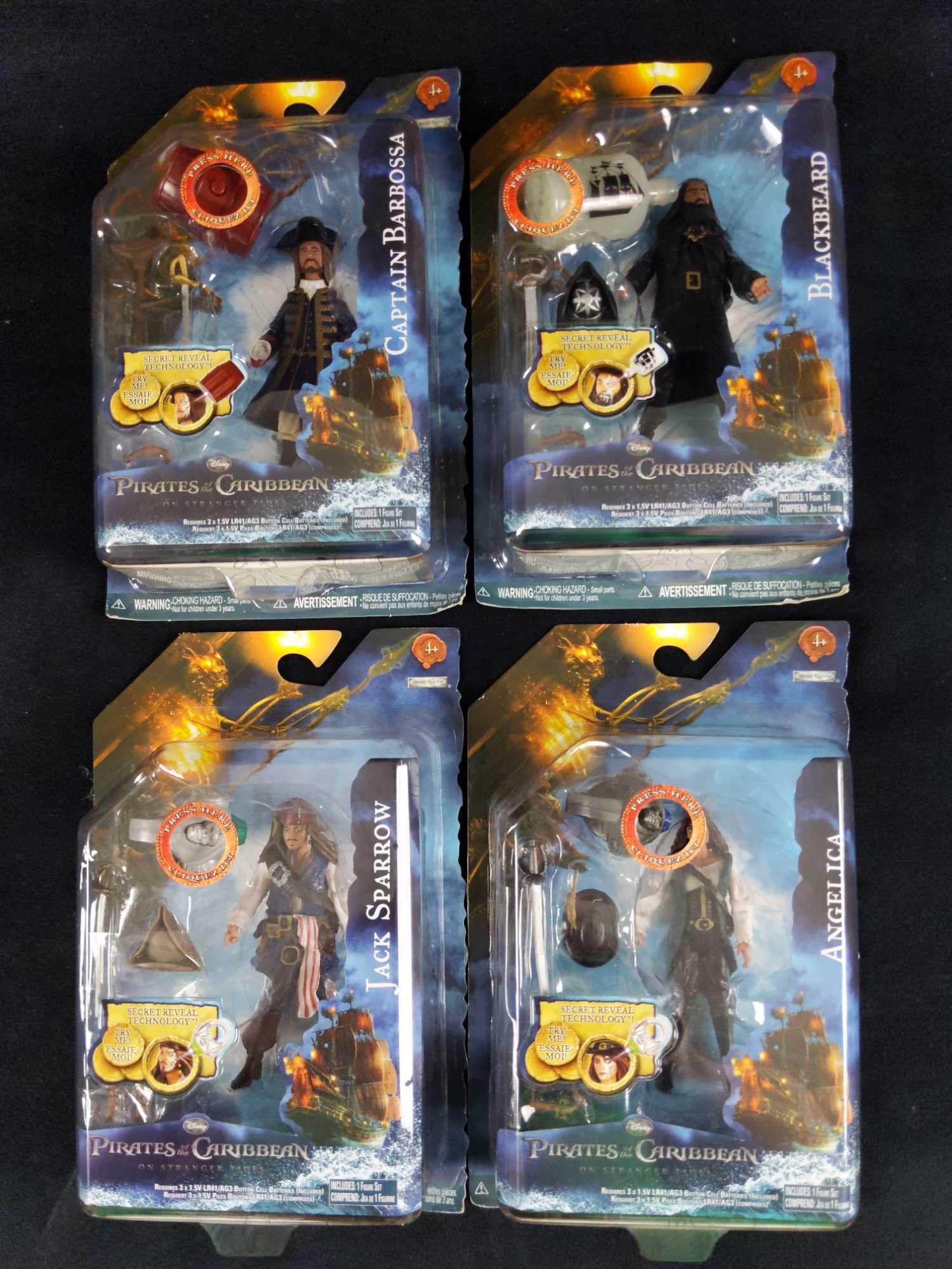 4 Disneys Pirates Of The Caribbean Movie Figures: Here are four Disney's Pirates Of The Caribbean: On Stranger Tides action figures with "Secret Reveal Technology". With included 'relics' that reveal the Pirate's 'secret within' which is usually show