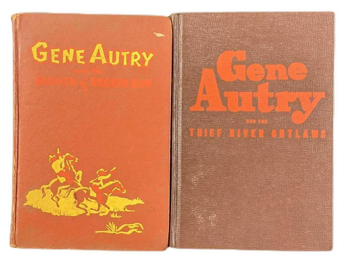 Two Vintage Gene Autry Singing Cowboy Hardcovers: This lot includes: (1) Gene Autry And The Thief River Outlaws. By Bob Hamilton. The book was published by the Whitman Publishing Company (Wisconsin) on 1944. (1) Gene Autry And The Badmen Of Broken Bo