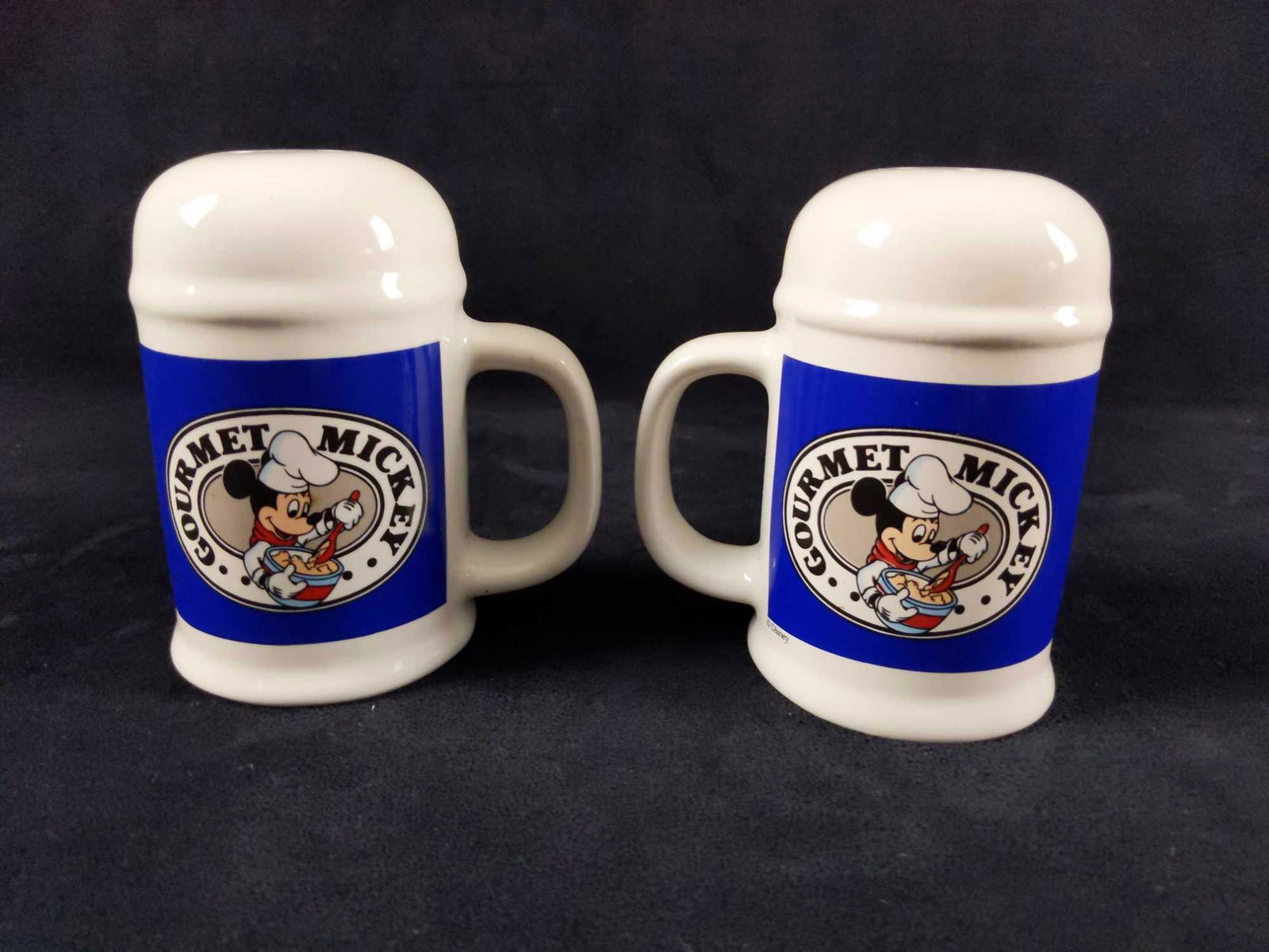 Rare Disney Gourmet Mickey Salt And Pepper Shakers: Ceramic "Gourmet Mickey Mouse" Salt And Pepper Shakers. Is approx 5" x 3" x 5". Similar to another set of shakers Disney released, which had a checker pattern or clear white, this solid blue version i