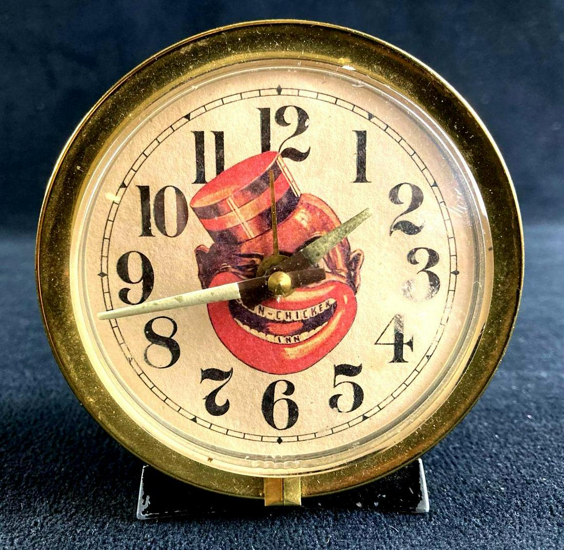 "Coon Chicken Inn" Desk Side Clock: This lot includes: (1) "Coon Chicken Inn" Desk Side Clock Condition is used and see photographs for details. The clock is in good shape with the picture on the front retaining original vibrant colors