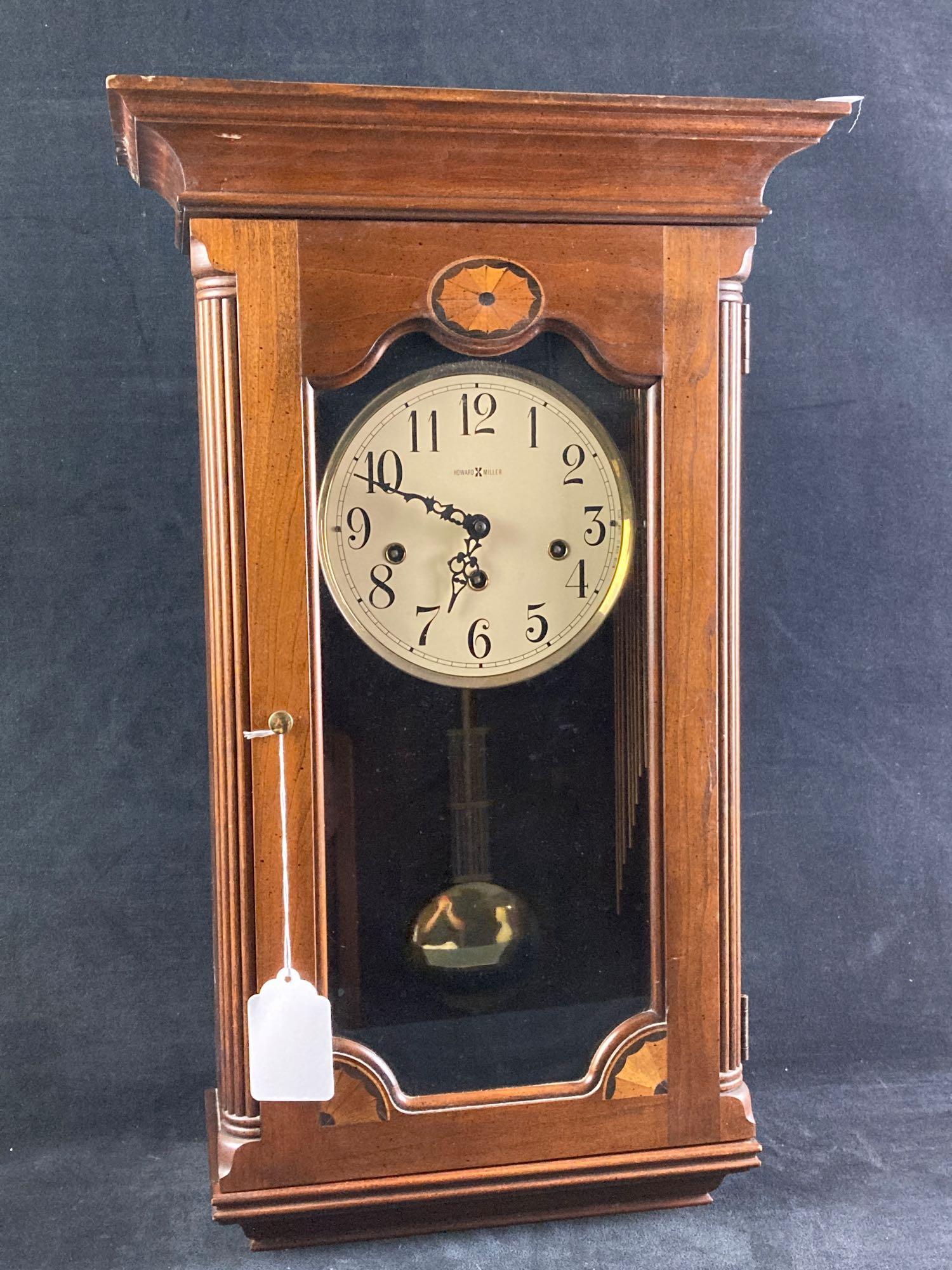 Howard Miller Pendulum Clock: Up for auction is an estate fresh Howard Miller Pendulum Clock. The key is included and the clock box has a hole on the reverse for easy access to the pendulum. This auction includes: (1) Howard Mille