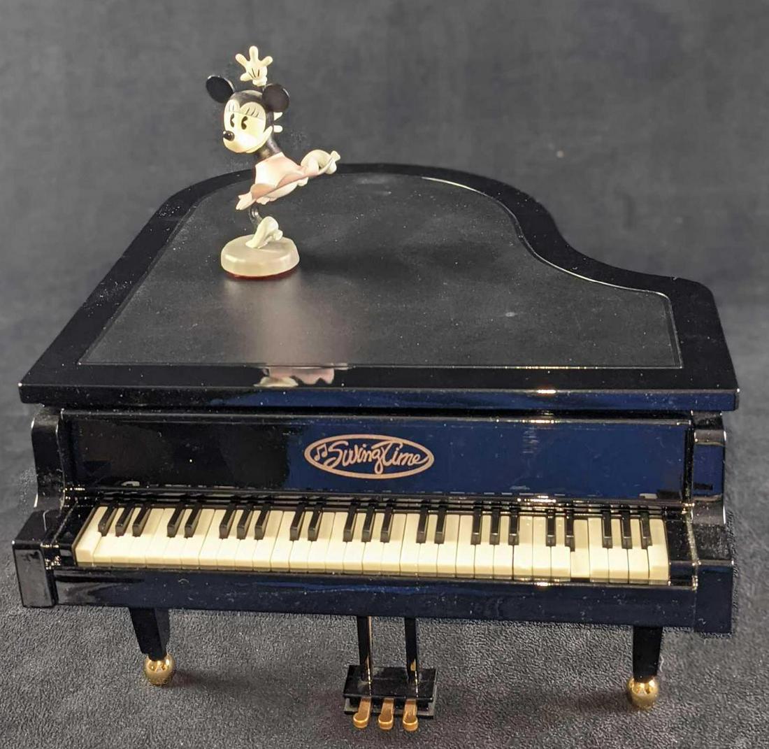 Animated Disney Minnie Mouse Swing Time Piano: Minnie Mouse swings to George Gershwin's "Havanola" as the keys move to the melody and Minnie spins on top of the piano. Minnie Mouse relives the swinging 20's by dancing on top of a beautifully detai