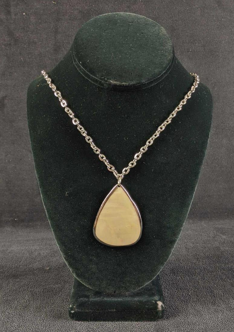 Chicoâ€™s Mother of Pearl Pendant Necklace: Chicoâ€™s Mother of Pearl Pendant Necklace This is a gently used Chico's necklace it has an inlay of mother of pearl in its pendant. 12in long