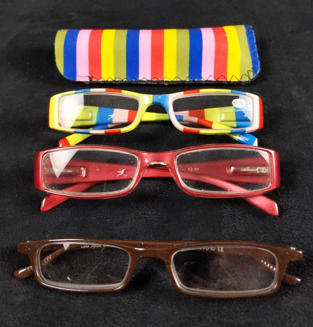 Three Pairs Of Unused Womens Reading Glasses: Here is a lot that includes: (1) Hummingbird rainbow glasses. Comes with a case. +3.00 (1) Hummingbird red color glasses. +3.00 (1) Optx Classic Reader +5.00 Glasses are all in good, unused condition