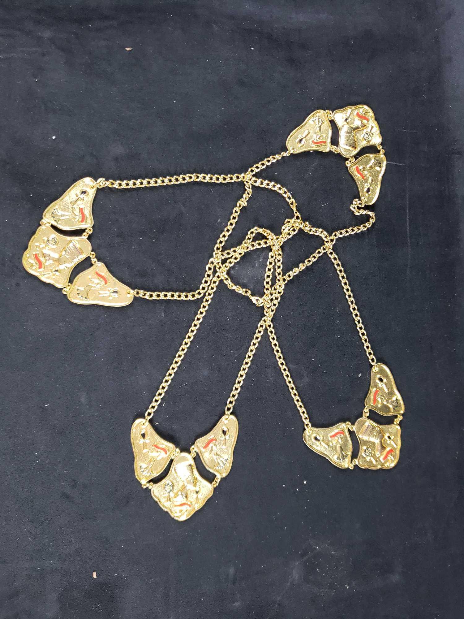 Lot of 4 Egyptian Style Disney World Crew Member: Lot of 4 Egyptian Style Disney World Crew Member Necklaces. This lot of necklaces is in good used condition. There is some very minor scratches from use (see images for condition details). The necklac