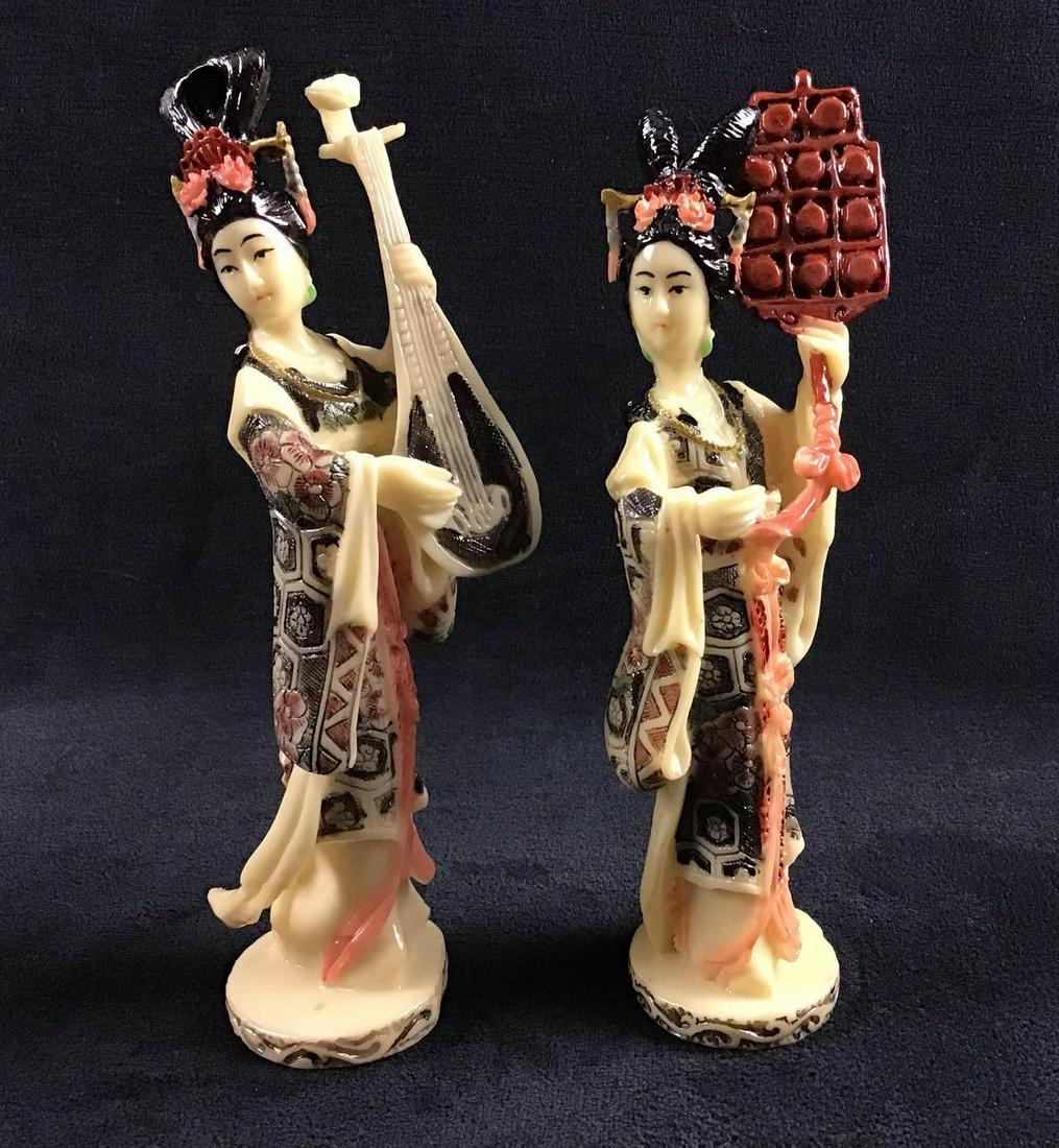 Geisha Chinese Art Figurines Instruments Lot of 2 A: Geisha Chinese Art Figurines Instruments Lot of 2 A. This is a lot of two Geisha figurines. They are made of a resin material. Geisha are Japanese entertainers. These figurines feature ornate designs 