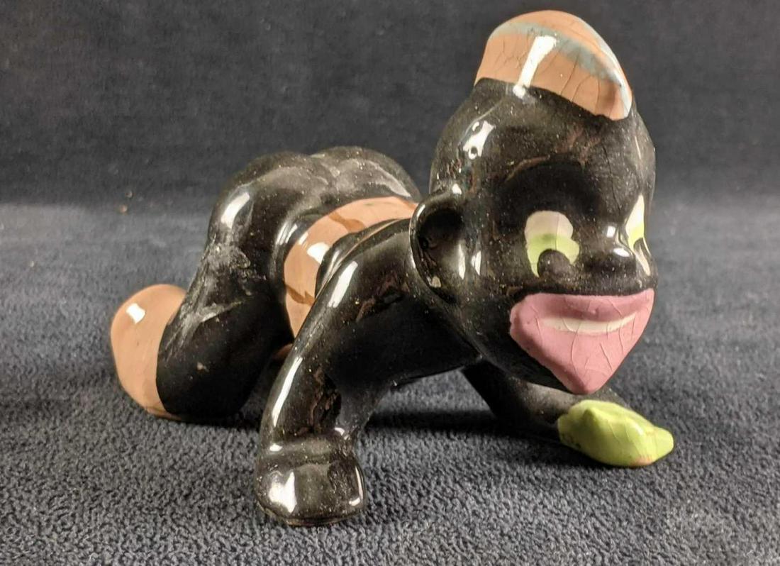 World War 2 Black Americana Brayton Laguna Soldier: World War 2 Black Americana Brayton Laguna Soldier This ceramic black soldier figurine is in good condition, it has some crazing and missing ceramic dice. It's supposed to depict a black soldier playi