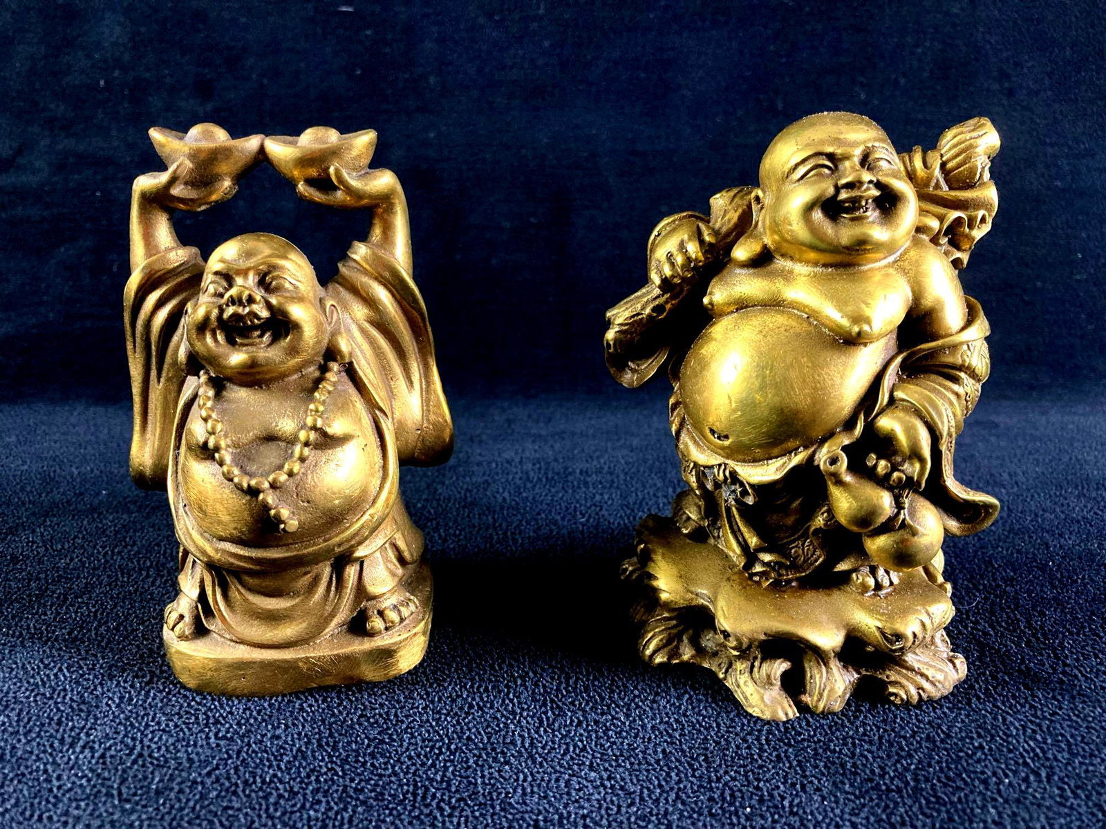 Set of (2) Buddhist Brass Figurines: This lot includes: (1) Set of Two Brass Buddhist Figurines Condition is used and see photographs for additional details. The brass figurines depict Buddha in various poses. The brass figurines have no