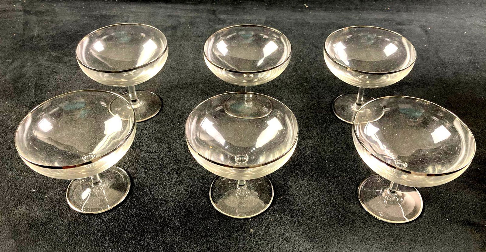 Set of (6) Rosenthal Champagne Saucers Lot #2: This auction includes: (6) Rosenthal Champagne Glasses The condition is used and refer to photographs for additional details. The glasses are still inside the original box and are in good shape. The d