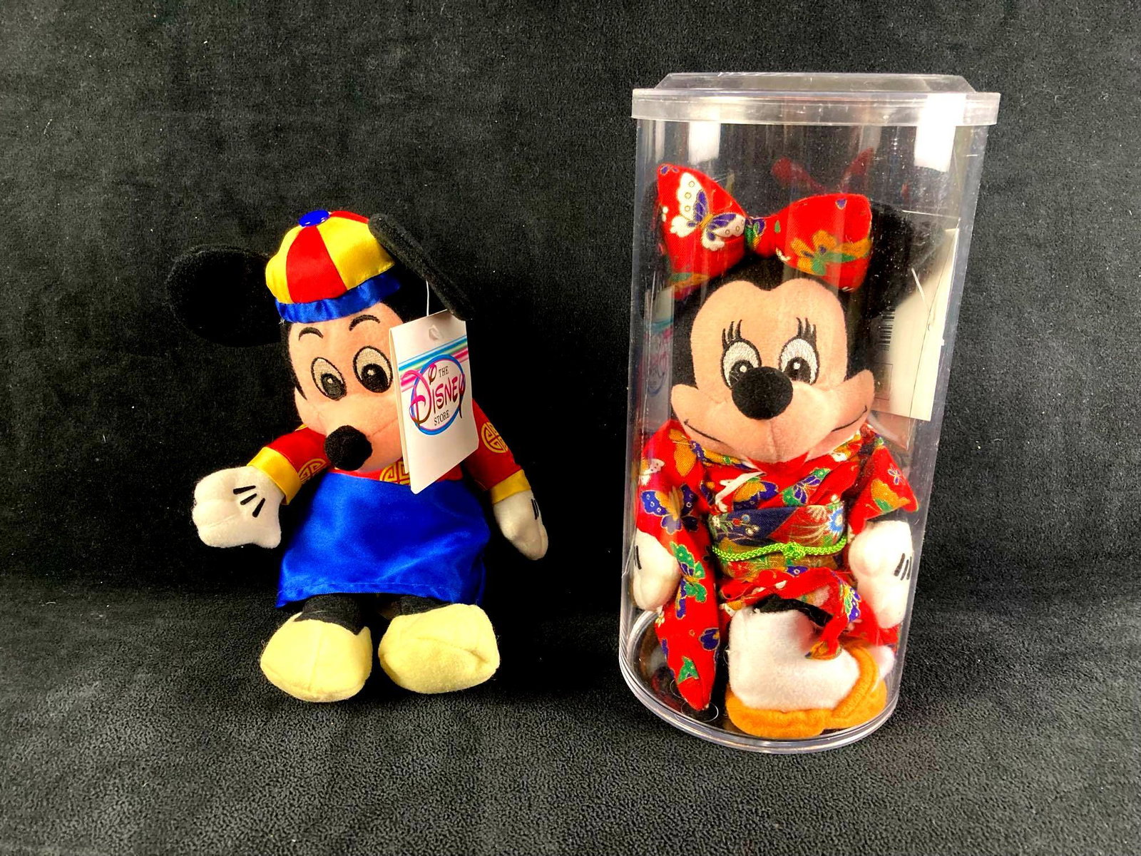 Set of (2) Disney Plush Bean Bag Dolls China and Japan: This lot includes: (1) Disney Bean Bag Plush Doll Japan Minnie (1) Disney Bean Bag Plush Doll China Mickey Condition is used and refer to photographs for additional details. Tokyo Minnie is protected 