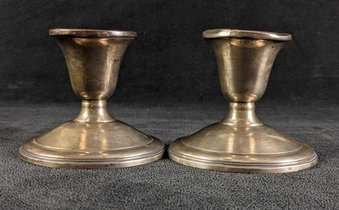 Sterling Silver Weighted Reinforced Candle Sticks: Sterling Silver Weighted Reinforced Candle Sticks These candlestick holders are from the brand La Pierre they a little tarnished and one is dented at the top. These are still great pieces to have. 3in